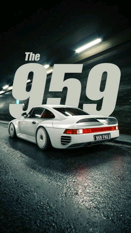 White sports car on a track with 'The 959' text in the background