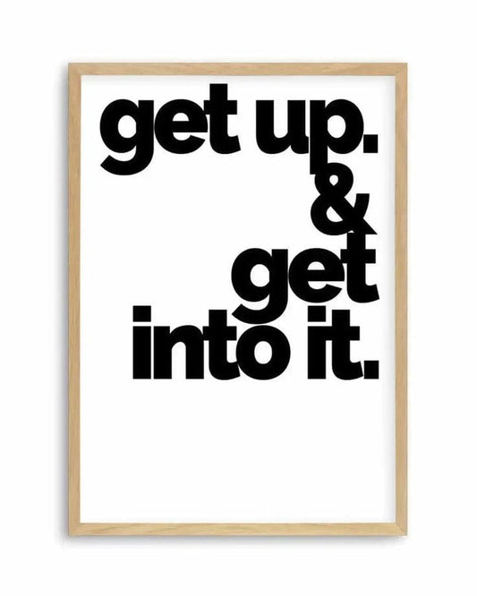 Motivational poster with 'get up. & get into it.' text in a wooden frame on a white background