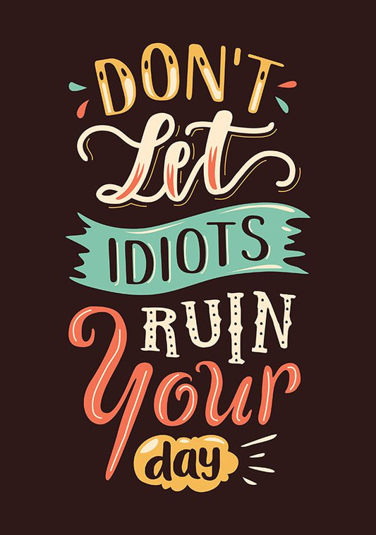 Motivational quote 'Don't Let Idiots Ruin Your Day' with colorful text on a dark background