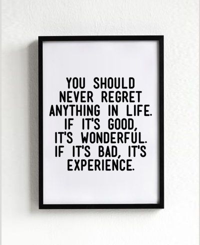 Framed poster with motivational quote on a white background