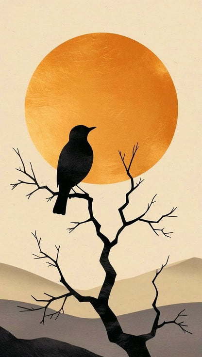 Silhouette of a bird on a branch with an orange sun and mountains in the background