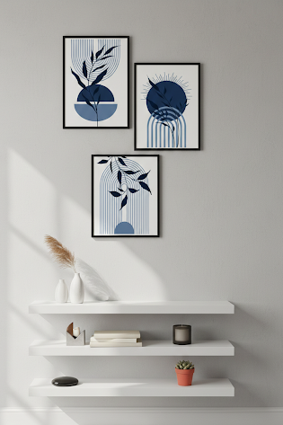 Three framed abstract artworks on a wall with a white shelf below containing decorative items.