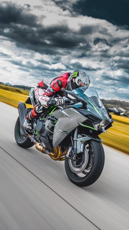 Motorcyclist on a high-speed ride with a dramatic sky