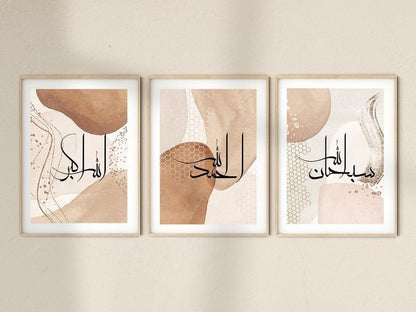 Three framed abstract artworks with Arabic calligraphy on a beige wall.