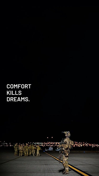 Soldiers in camouflage standing on a runway with a dark sky and text 'COMFORT KILLS DREAMS'.