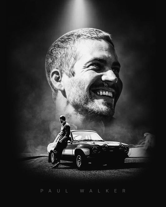 Black and white image of a man sitting on a car with a large portrait of a smiling man above him.