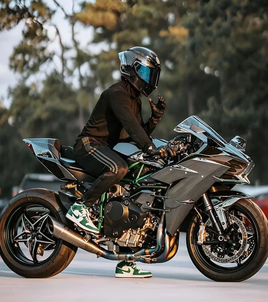 Person riding a motorcycle with a blurred background