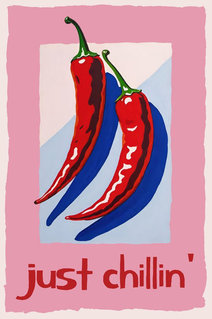 Two red peppers on a blue background with 'just chillin'' text on a pink border