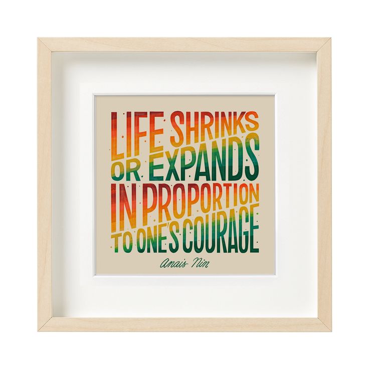 Framed print with motivational quote 'Life shrinks or expands in proportion to one's courage' by Anais Nin.