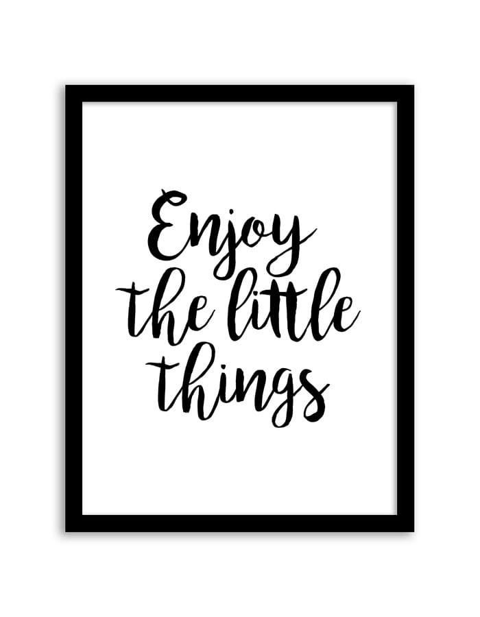 Framed print with 'Enjoy the little things' text on a white background