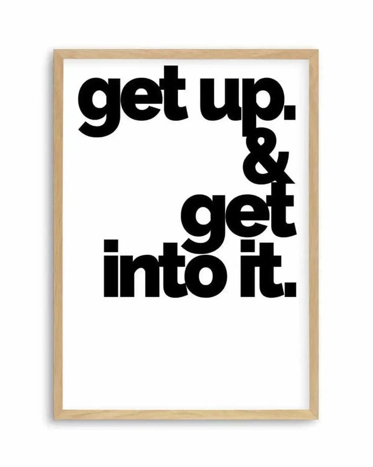 Motivational poster with 'get up. & get into it.' text in a wooden frame on a white background