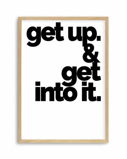Motivational poster with 'get up. & get into it.' text in a wooden frame on a white background